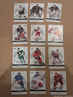 12 Trilogy base cards laid out, clear view of player images and set design