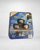 Full blister package showing three headlamps and battery pack