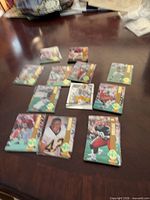 Group of Classic Four Sport Gold Logo football cards spread on table