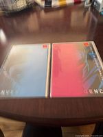 Front view of both bagged Batman Convergence comics, blue and pink covers