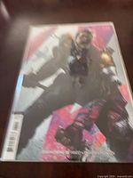 Front view of bagged Deathstroke #55 comic showing cover art
