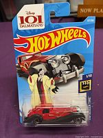 Front view of sealed Hot Wheels Disney 101 Dalmatians Cruella de Vil car in packaging