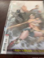 Front view of bagged Justice League variant comic