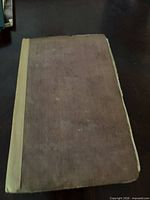 Front cover showing cloth board and taped spine