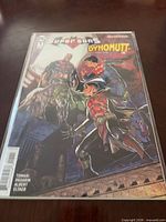 Front view of bagged Super Sons #1 variant cover comic showing main artwork and characters