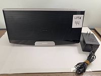 Front view of Sony RDP-XF300iP speaker with AC adapter