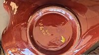 Underside of brown glazed ashtray showing Japan mark