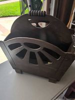 Oblique view showing exterior sunburst cut-out design and feet