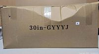 Closed cardboard box marked 30in-GYYYJ