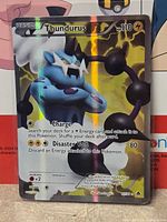 Front of Thundurus full-art holographic card showing artwork, attacks and HP