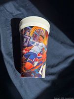 Front view showing Pulisic kicking ball with dynamic artwork