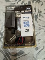 Front view of packaged GRIP 12V battery float charger set
