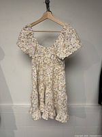 Front view of Arden floral dress on hanger
