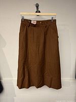 Front view of brown long skirt hanging