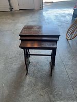 Three tables stacked together front view