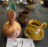 All three groupings: marbled vase, brown pitcher, yellow miniature pitcher on basin