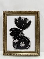 Front view of framed black and white floral canvas art