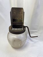 Full view of grinder assembled on glass jar