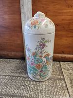Full view of jar front showing floral and bird design