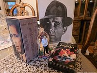 Group shot showing 3-tape set, Casablanca tape, ornament, framed photo