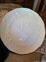 Front view of Lenox anniversary plate showing embossed design and gold rim