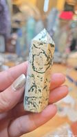 Front view of moss agate tower showing green inclusions