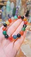Full view of bracelet showing complete strand of multicolor 10 mm gemstone beads