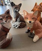 Front view of all four fox figurines