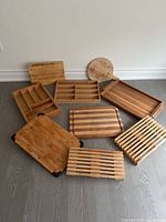 Overview of all wooden boards, trays, racks and organizers laid out