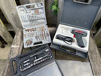 Overview of all three tool cases opened showing contents
