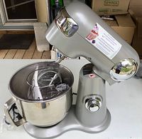 Mixer tilted up showing bowl and attachments