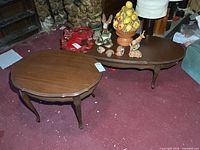 Coffee table and end table side by side on carpeted floor
