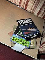Stack of four hardcover coffee table books on a table