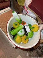 Top view of enamel basin and all glass vegetables
