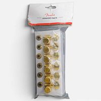 Sealed retail package showing six gold tuners and bushings