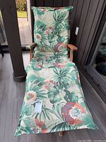Full view of chaise lounge with cushion and footrest