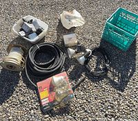 Overall lot showing cables, wire spool, bulb pack, flood fixtures, junction boxes and crate