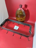 Pot rack and decorative vegetable bottle displayed together