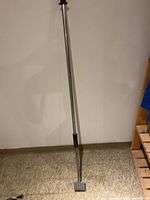 Full view of floor scraper showing length and grips