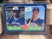 Front of 1986 Fleer card showing Cecil Fielder and Cory Snyder portraits, sticker 180 visible