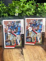 Front view of two sleeved 2019 Panini Score Draft D.K. Metcalf rookie cards