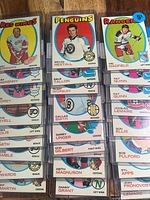 First image shows three columns of sleeved 1971 O-Pee-Chee hockey cards