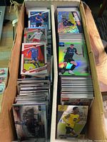 Two rows of soccer trading cards filling a long storage box