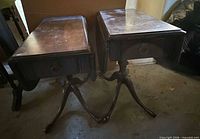 Front view of both side tables showing drawers, pedestals and legs