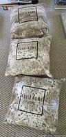 Three sealed Guillaume Home snow leopard faux fur pillows