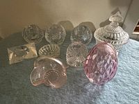 Group of all glass items on blanket