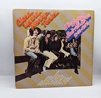 Front gatefold sleeve with title and band photo