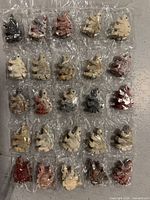 Full sheet of 25 individually wrapped stone stegosaurus figurines