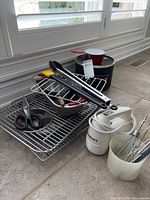 Group shot showing mixer, soup pot, cooling racks, mixing bowl and utensils