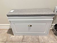 Front view of white bench with cushion and pull knob